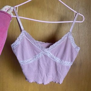 Cute pink tank top with lace details.